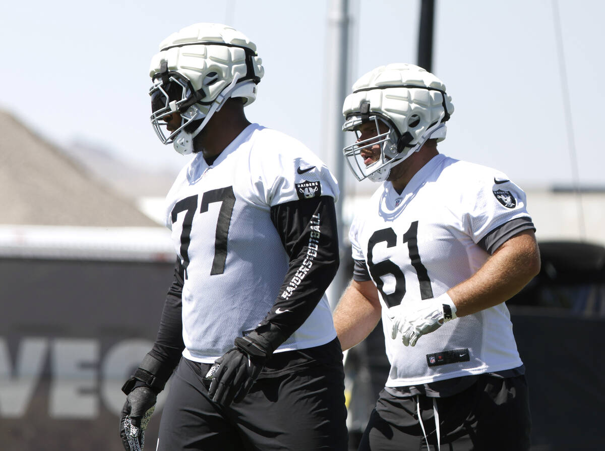 Raiders offensive tackle Thayer Munford Jr. (77) and guard Jordan Meredith (61) take the field ...