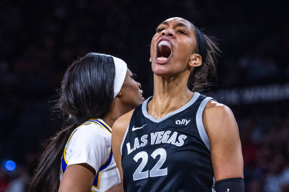 Aces center A'ja Wilson (22) after a score and foul against Los Angeles Sparks forward Rickea J ...