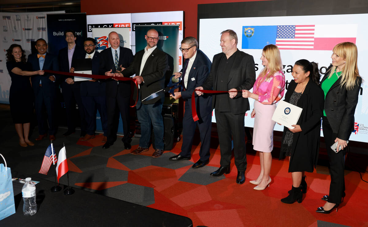 Dignitaries and entrepreneurs from Poland and Nevada help cut the ribbon to launch VisionariesN ...