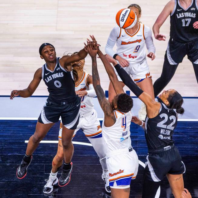 Aces guard Jackie Young (0), Phoenix Mercury forward Natasha Mack (4) and Aces center A'ja Wils ...