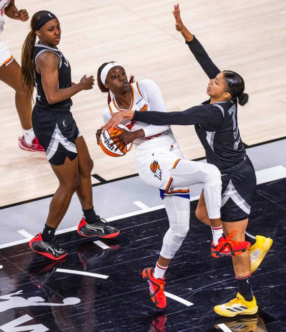 Phoenix Mercury guard Kahleah Copper (2) has the ball jammed by Aces forward Alysha Clark (7) o ...