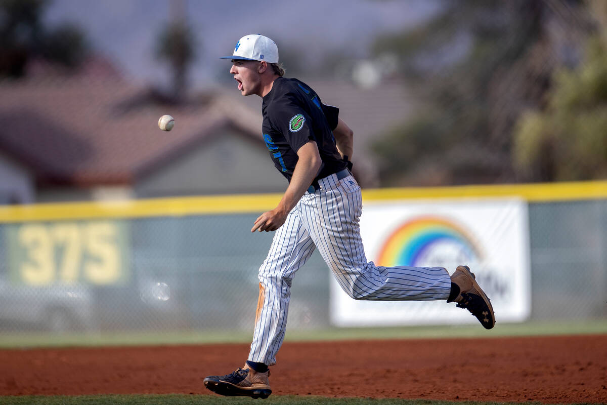 Green Valley’s Brady Ballinger runs in field in celebration after his team won a high sc ...