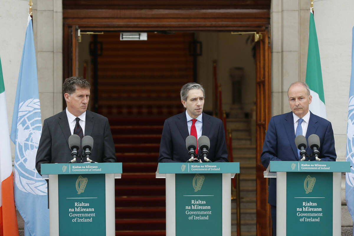 The three Irish Government leaders from left, Minister Eamon Ryan, Taoiseach Simon Harris and T ...