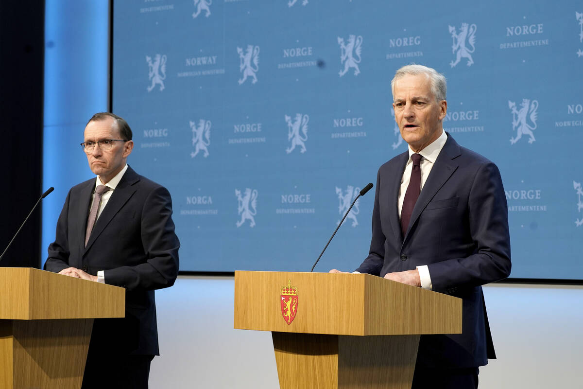 Norway's Prime Minister Jonas Gahr Store, right, with Foreign Minister Espen Barth Eide, speaks ...