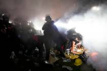 FILE - Police enter an encampment set up by pro-Palestinian demonstrators on the University of ...