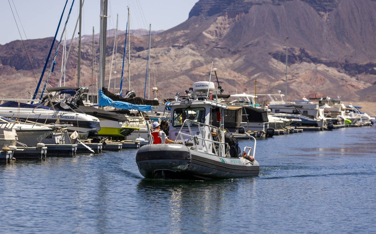 A law enforcement patrol boat makes its way back into the Lake Mead Marina during a safe boatin ...