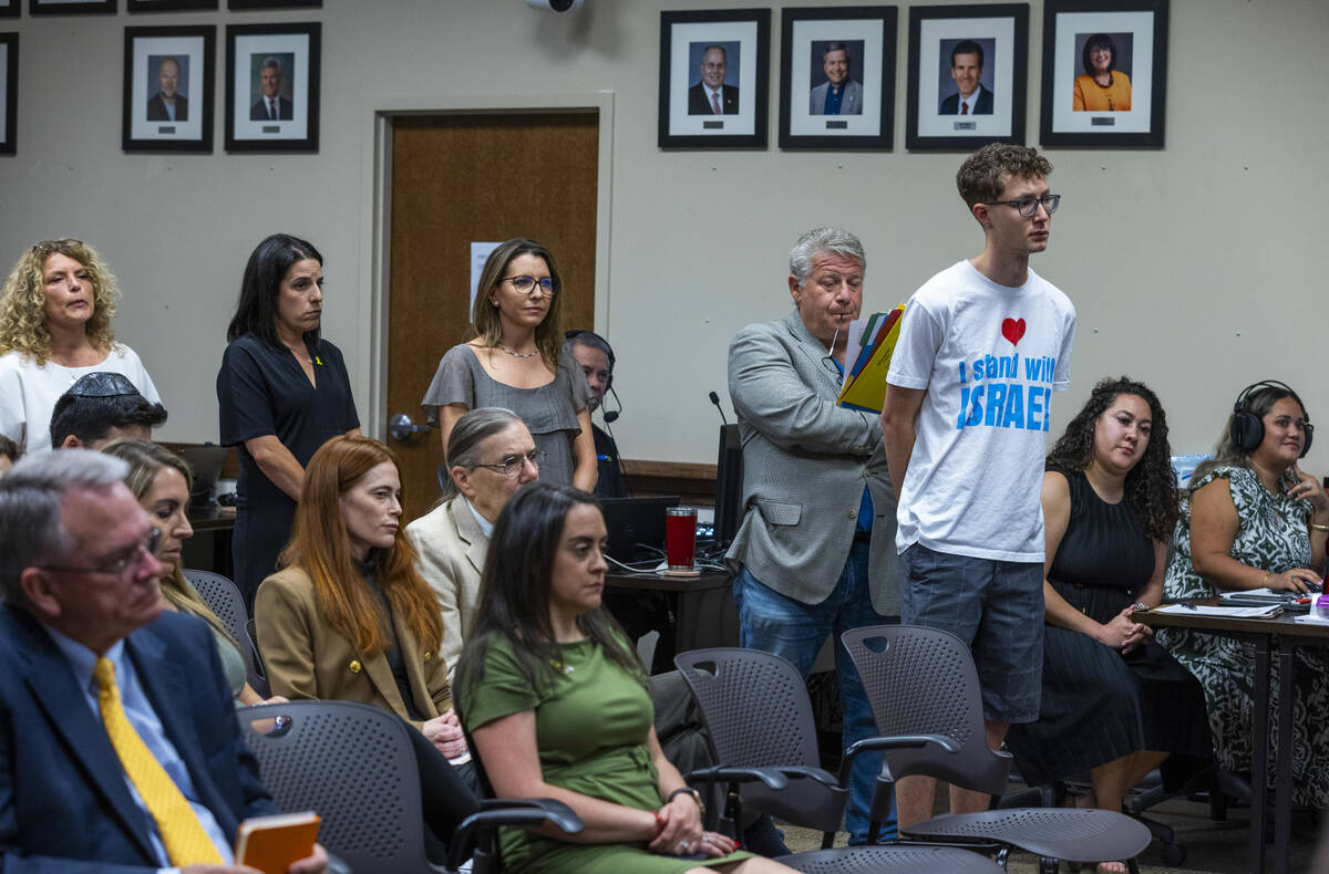 Individuals line up for public comment during an NSHE Board of Regents meeting where pro-Israel ...