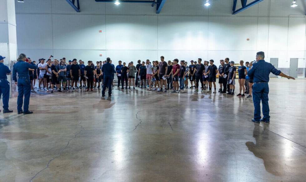 Participants receive instructions during the Las Vegas Fire & Rescue free community boot ca ...