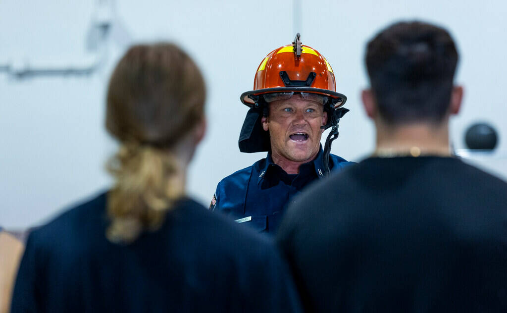 Captain Vernon Reinhart talks about the helmet as part of the turnout gear worn during the Las ...