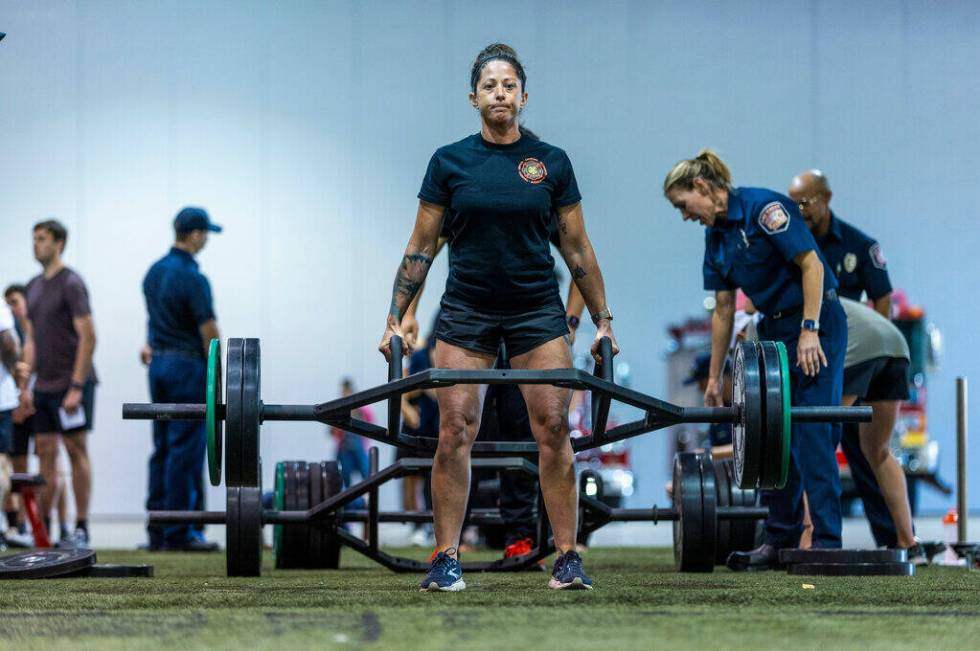A participant does a dead lift during the Las Vegas Fire & Rescue free community boot camp ...