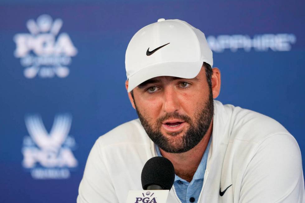 FILE - Scottie Scheffler speaks during a news conference after the second round of the PGA Cha ...