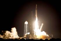 A SpaceX Falcon 9 rocket with the Crew Dragon capsule lifts off from Launch Pad 39A at the Kenn ...