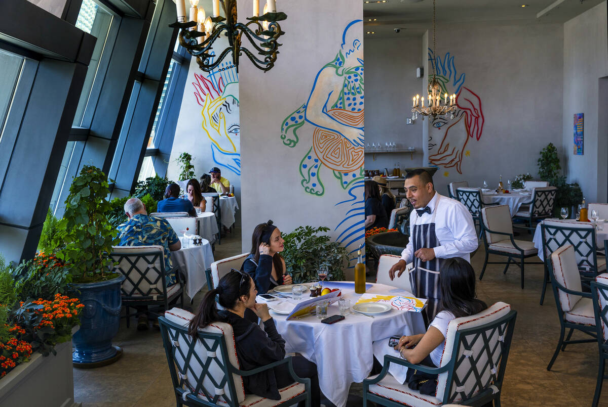 Guests enjoy the covered patio during brunch at LPM within the Cosmopolitan on Saturday, May 25 ...