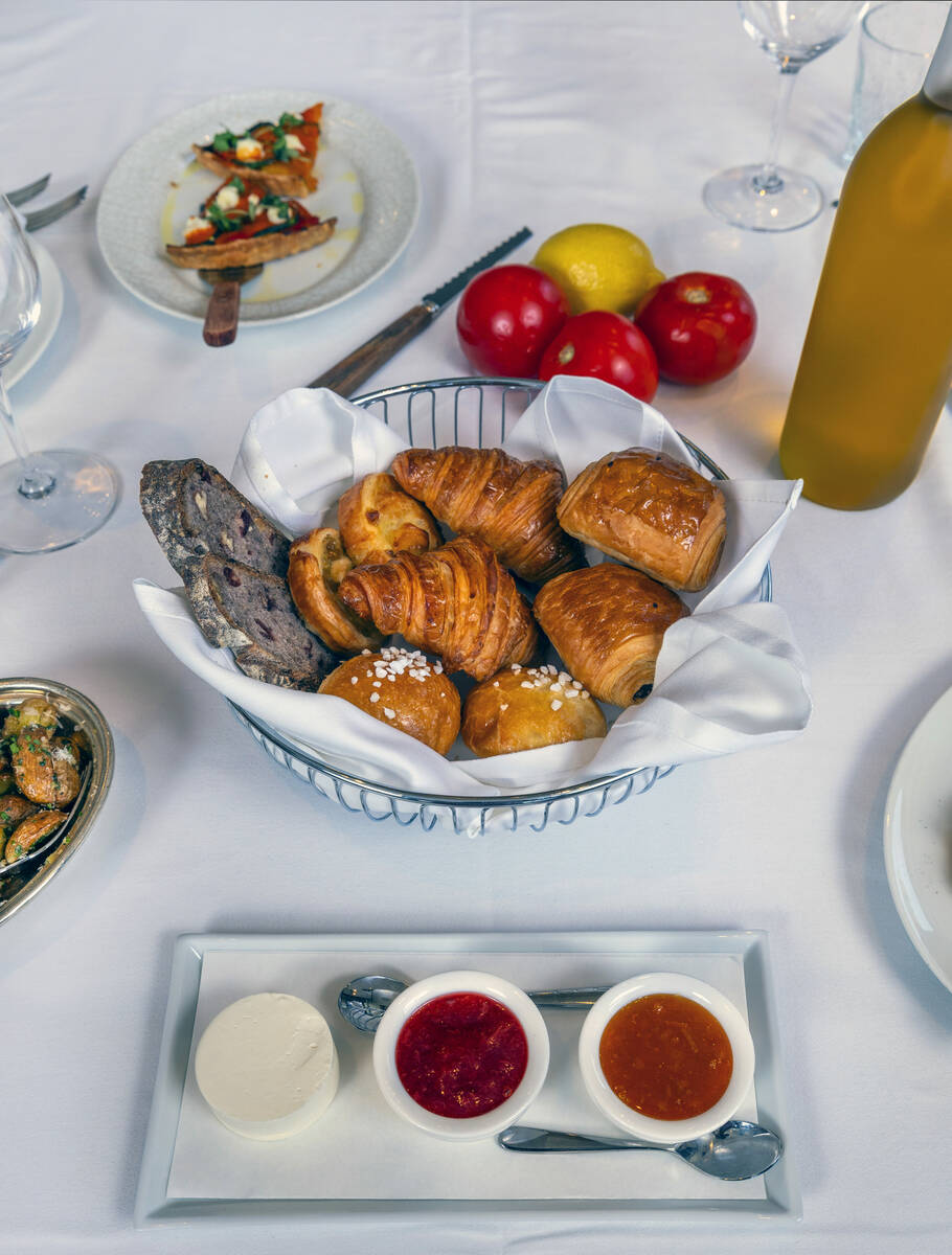 Croissant, Pain Au Chocolat, Kouign-Aman, baguette and assortment of jams and French butter dur ...