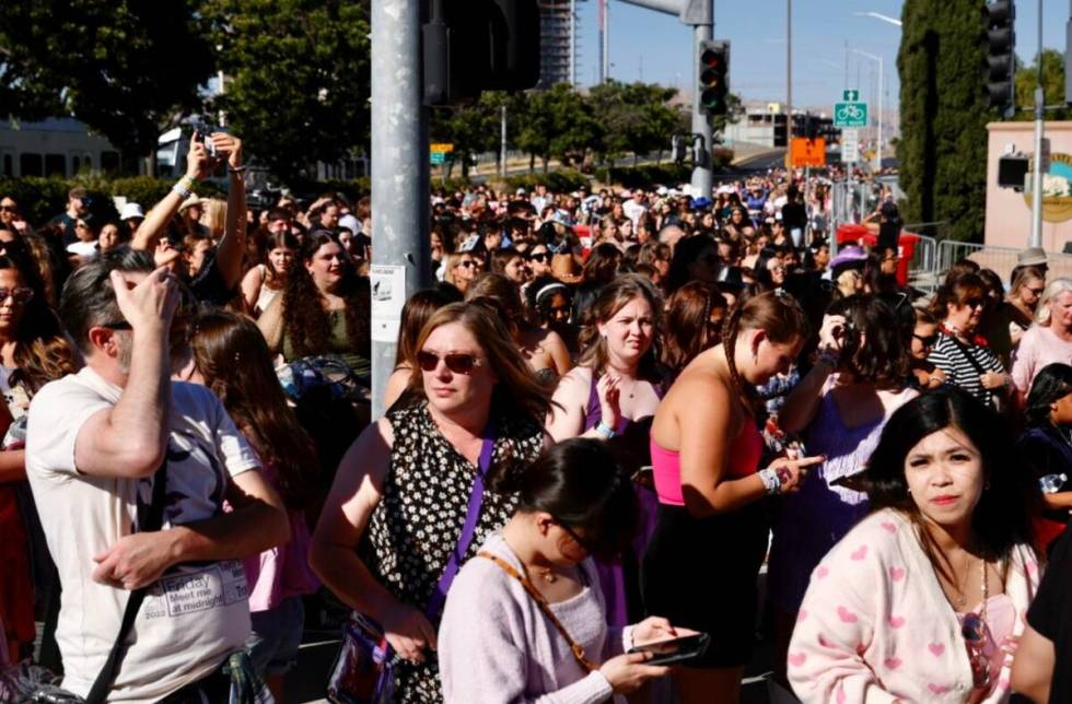 Fans wait to go through security before Taylor Swift performs at Levi's Stadium in Santa Clara, ...