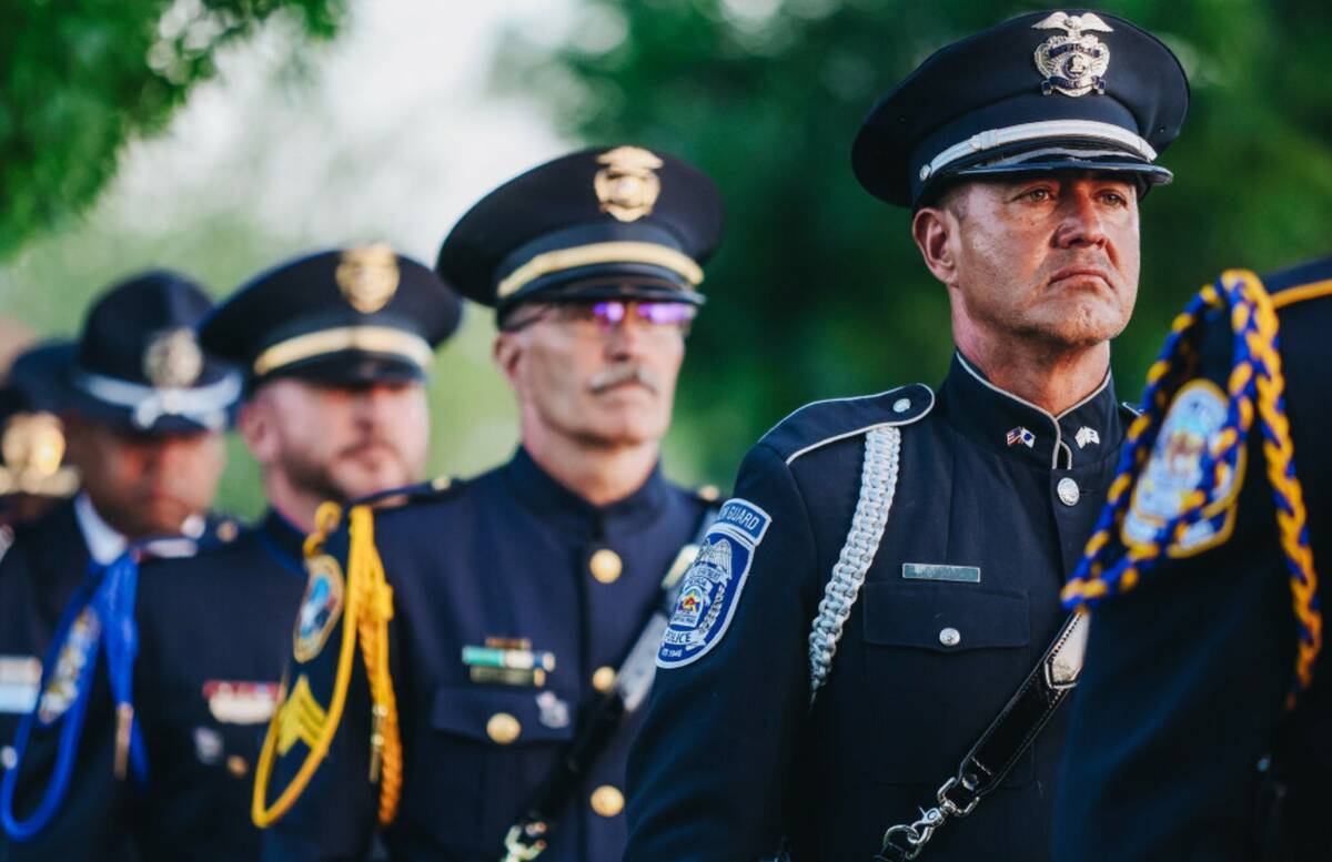 Members of the North Las Vegas Police honor Guard stand at attention during the Southern Nevada ...