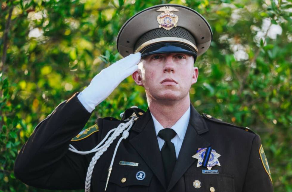 A police officer salutes during the Southern Nevada Law Enforcement Memorial Ceremony at Police ...