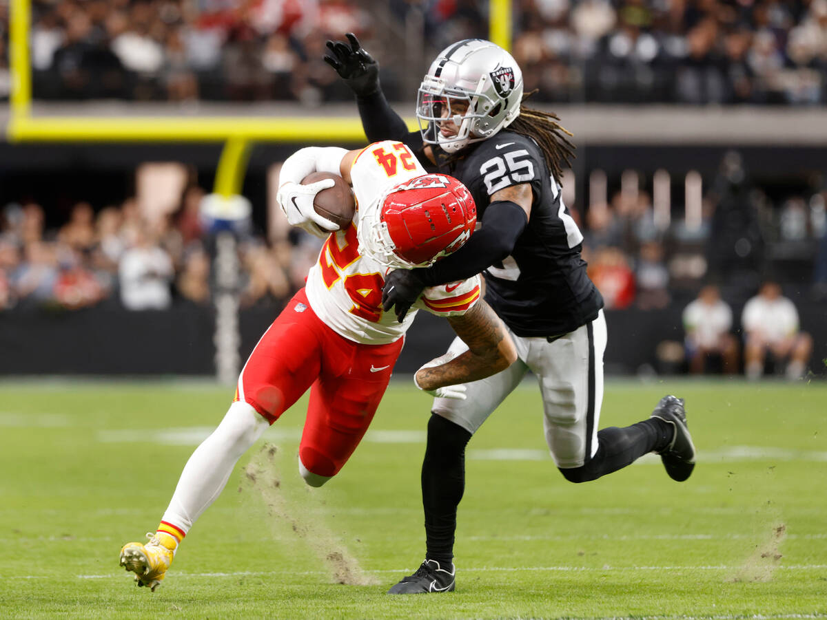 Raiders safety Tre'von Moehrig (25) tries to takedown Kansas City Chiefs wide receiver Skyy Moo ...