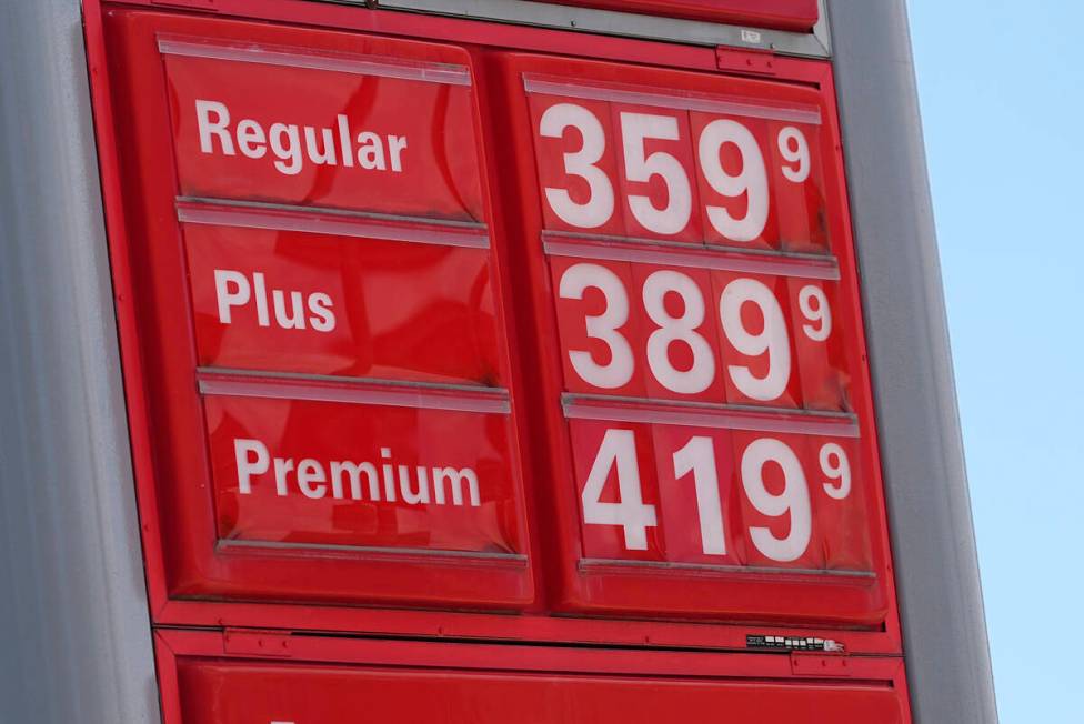 Gasoline prices are displayed on a sign outside a service station as the Memorial Day holiday t ...