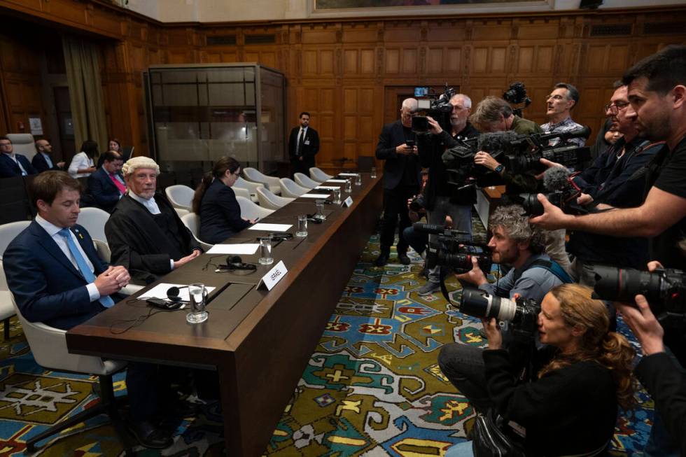 Journalists take images of Israel legal team before Judges enter the International Court of Jus ...