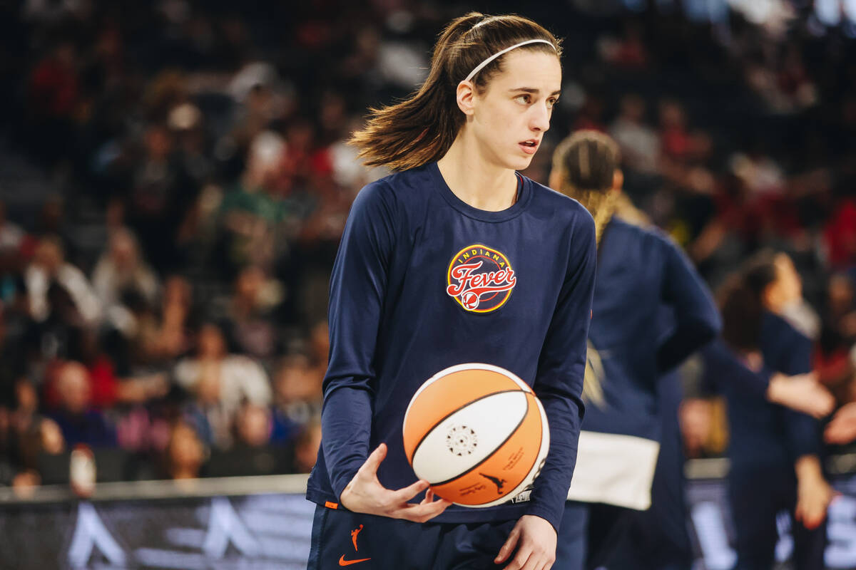 Indiana Fever guard Caitlin Clark (22) warms up on the court during a game between the Aces and ...