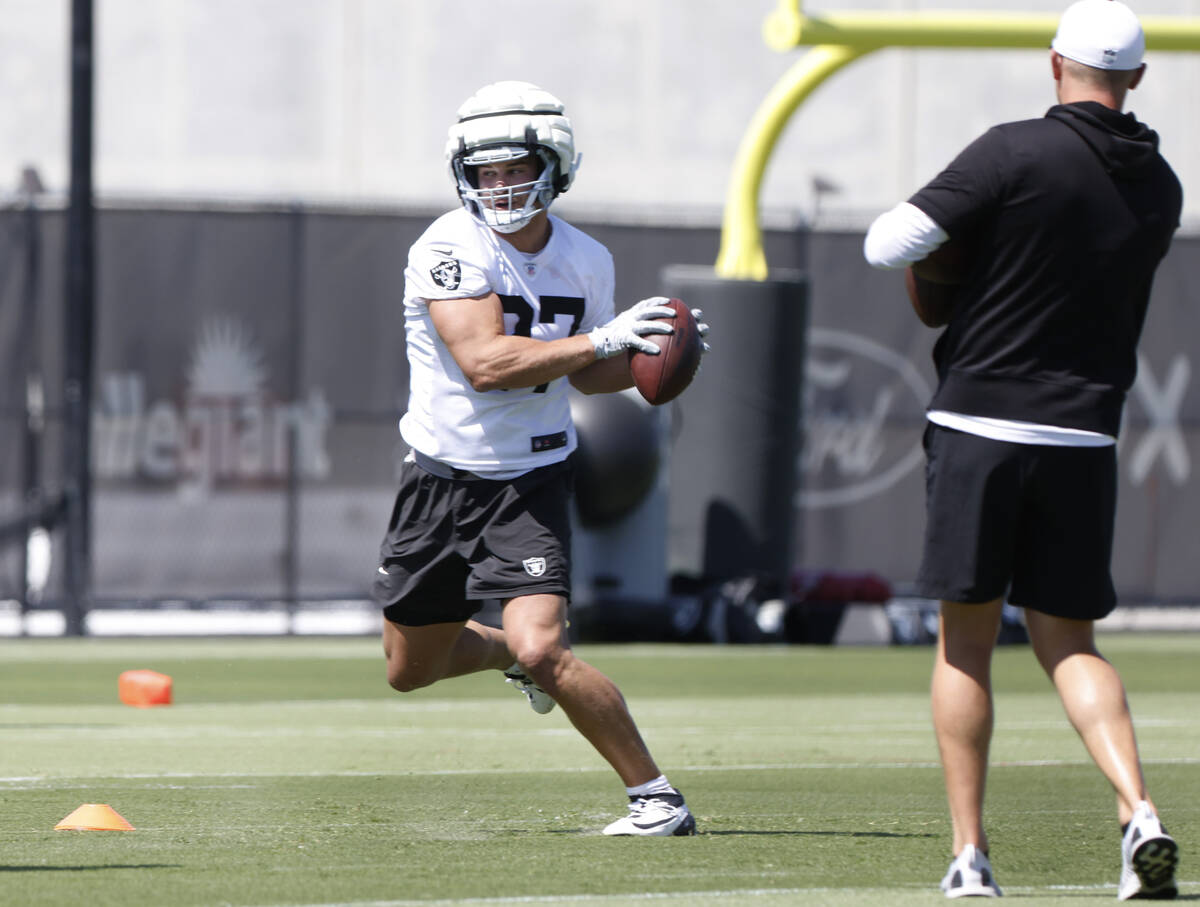 Raiders tight end Michael Mayer catches the ball as he runs through drills during organized tea ...