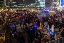 Police use horses to disperse demonstrators during a protest against Israeli Prime Minister Ben ...