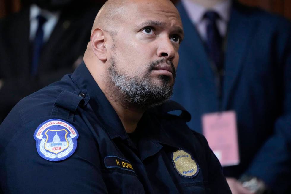 FILE - U.S. Capitol Police Sgt. Harry Dunn listens as the House select committee investigating ...