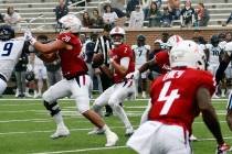 South Alabama quarterback Carter Bradley looks at wide receiver Caullin Lacy (4) near the corne ...