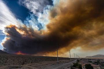 Smoke from the Mahogany Fire near Mount Charleston moves across the northwest valley on June 28 ...