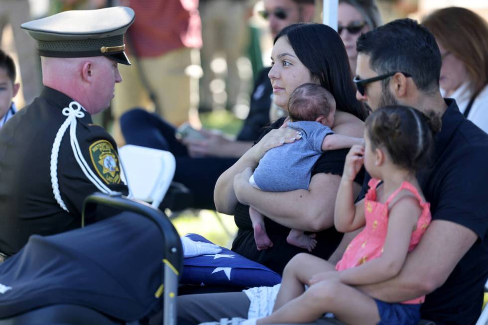 Kylee Prendes, daughter of fallen Las Vegas police Sgt. Henry Prendes, receives an American fla ...