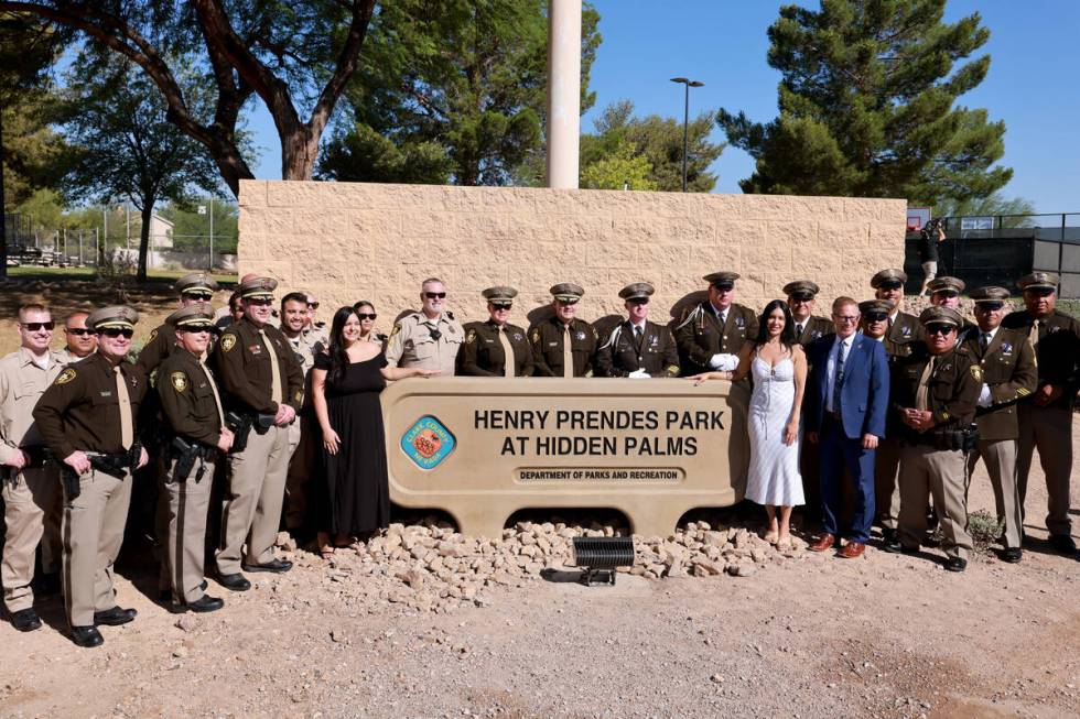 Kylee, left, and Brooke Prendes, daughters of fallen Las Vegas police Sgt. Henry Prendes, pose ...