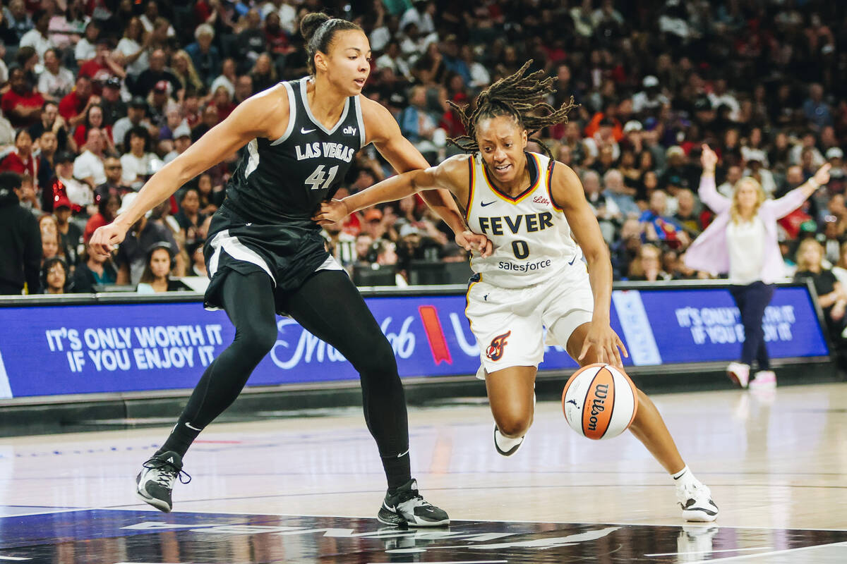 Aces center Kiah Stokes (41) guards Indiana Fever guard Kelsey Mitchell (0) during a game betwe ...