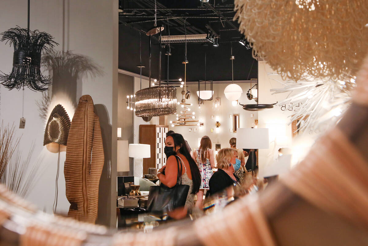 Guests walk around the showroom for Arteriors at the Las Vegas Market at the World Market Cente ...