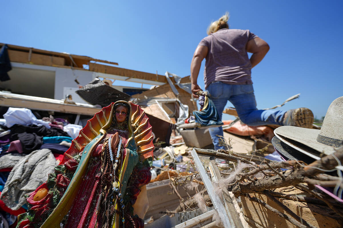 A Guadalupe Virgin statue lays among the rubble of the destroyed home of Juana Landeros, who ro ...