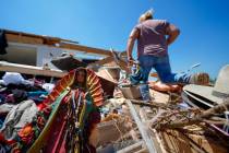A Guadalupe Virgin statue lays among the rubble of the destroyed home of Juana Landeros, who ro ...