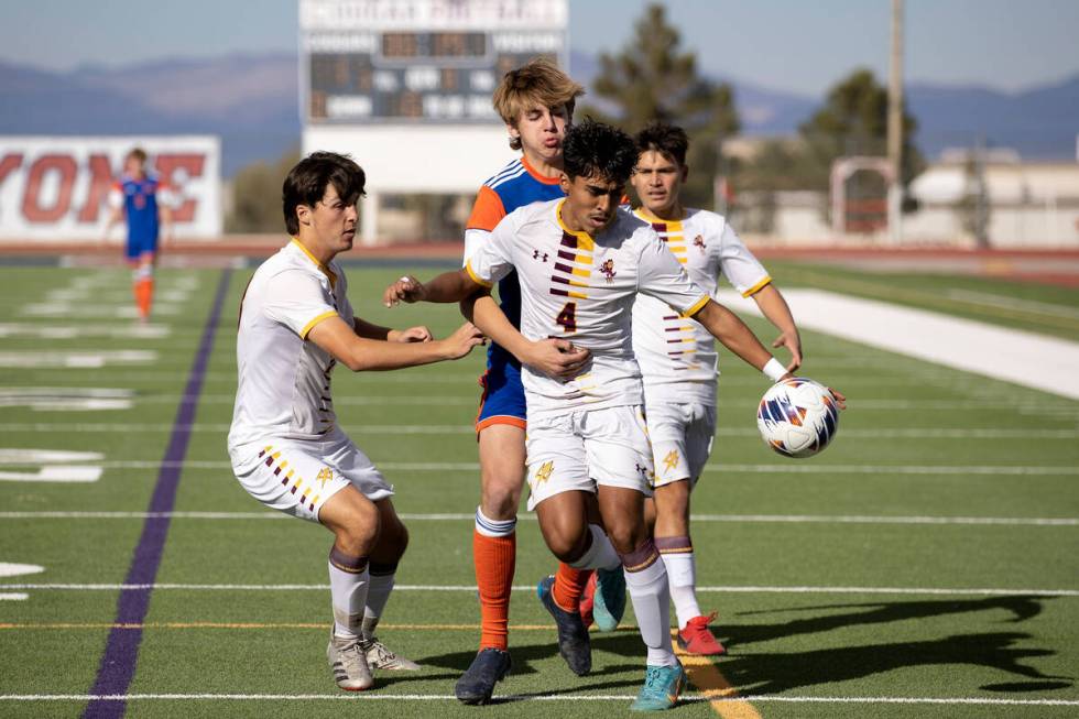 Eldorado players including Sebastian Puentes (4) defensively surround Bishop Gorman’s Ch ...