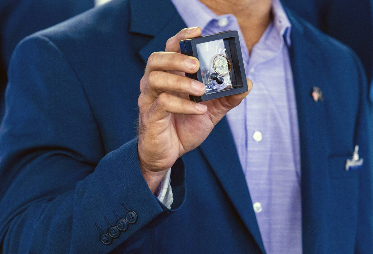 January 6 U.S. Capitol Police Sgt. Aquilino Gonell holds up pieces of glass, metal and rubber b ...