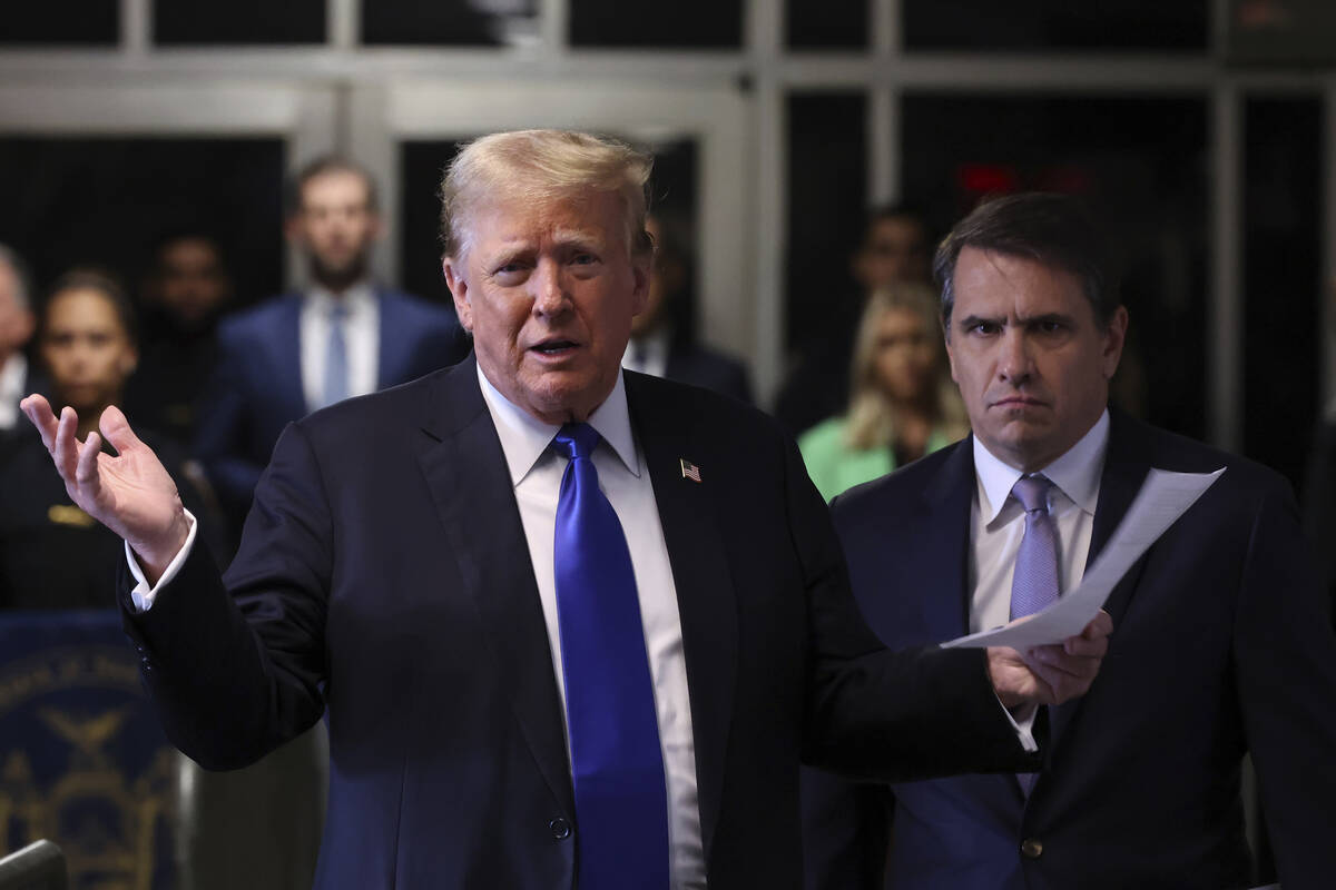 Former President Donald Trump speaks to the media as he arrives at Manhattan criminal court dur ...