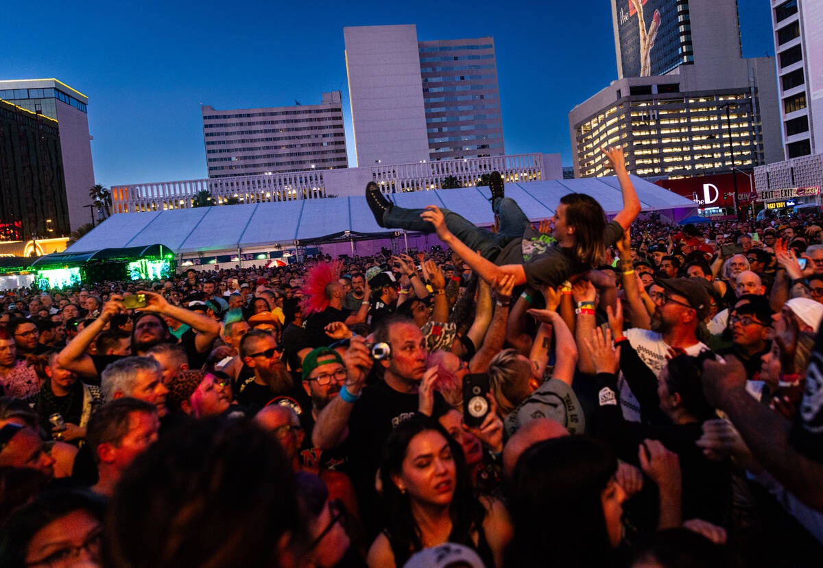 A fan crowd surfs as Gogol Bordello performs during the Punk Rock Bowling music festival at Dow ...