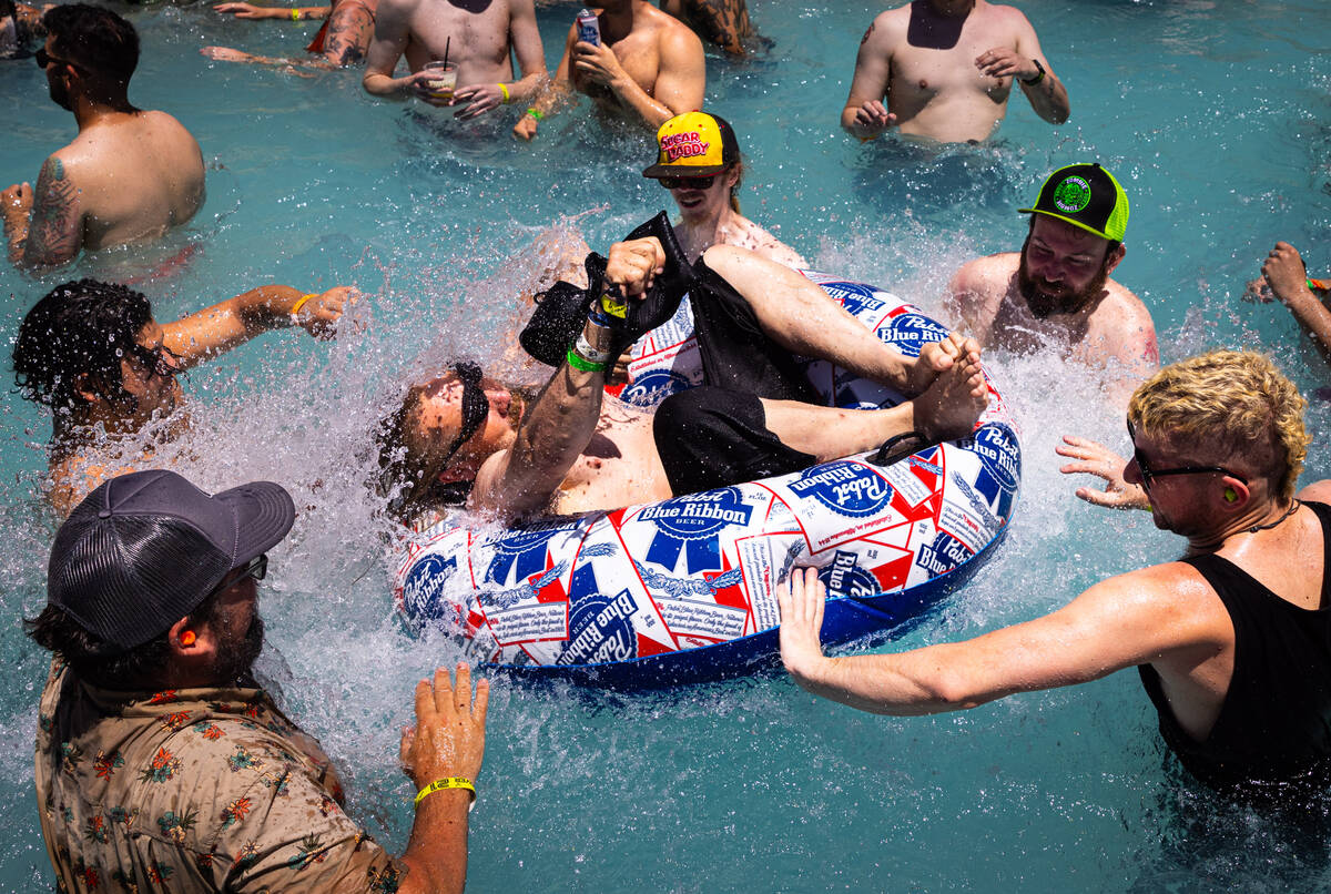 Festival attendees dance and mosh in the pool as Minneapolis-based band Vial, not pictured, per ...