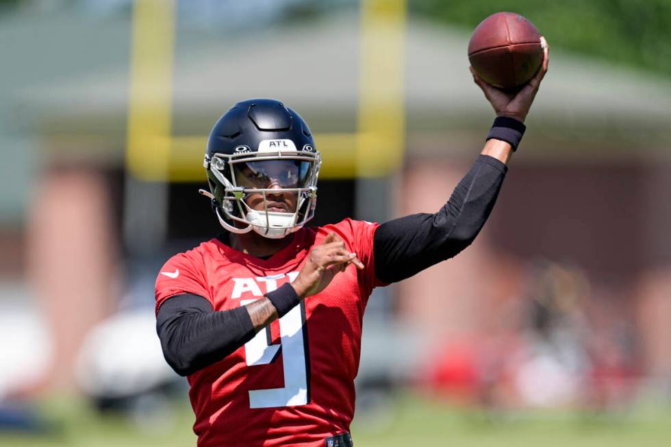 Atlanta Falcons first round draft pick quarterback Michael Penix Jr., runs a passing drill duri ...