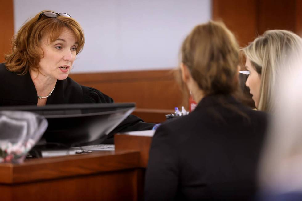 Justice of the Peace Noreen DeMonte talks to public defender Lisa Chamlee, left, and prosecutor ...