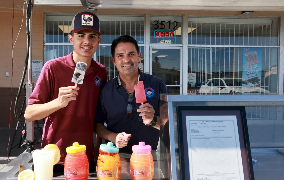 Alan Carrera, 16, and his father José Manuel Carrera show some of their products and the first ...