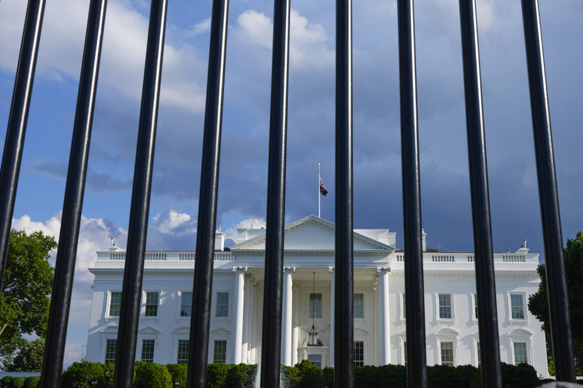 The White House in Washington is seen past the security fence on Thursday, May 30, 2024. Former ...