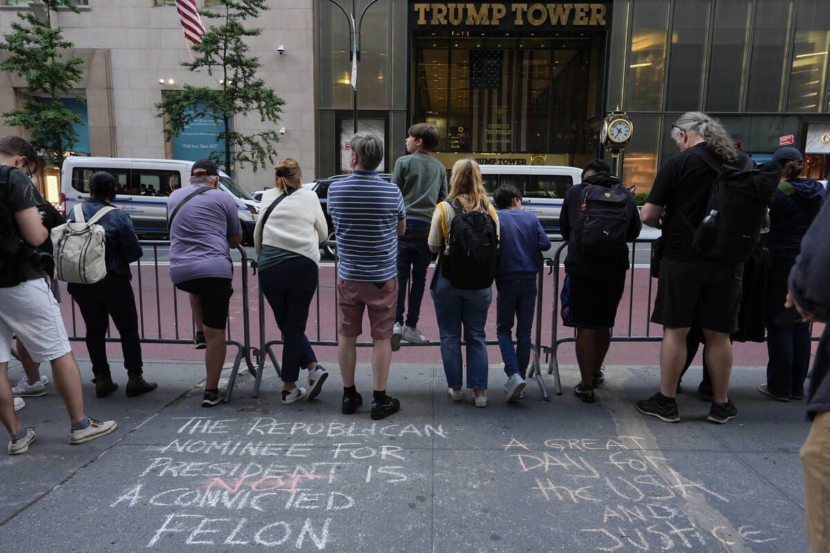 A crowd gathers across the street from Trump Tower after the guilty verdict announced against D ...