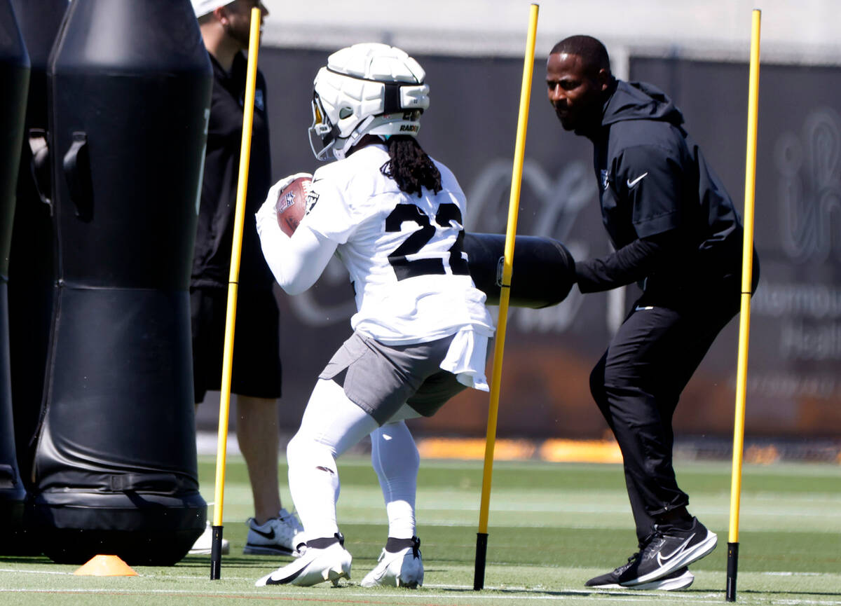 Raiders running back Alexander Mattison (22) runs through drills during team's practice at the ...