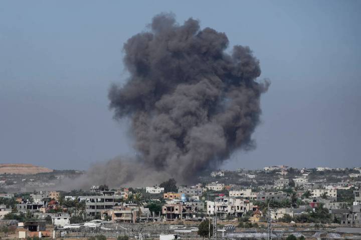 Smoke rises following an Israeli airstrike in Rafah, Gaza Strip, Thursday, May 30, 2024. (AP Ph ...