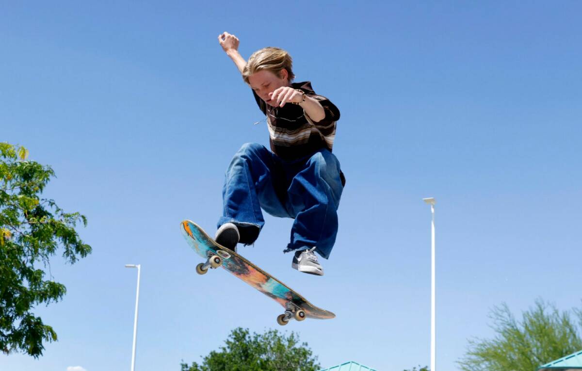 Ashton Kopack jumps high in the air on his skateboard at YMCA Skate Park, on Friday, May 31, 20 ...