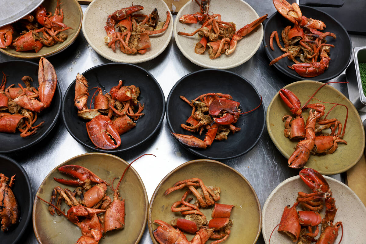 In progress lobster dishes are shown during a collaborative lunch with Esther’s Kitchen ...